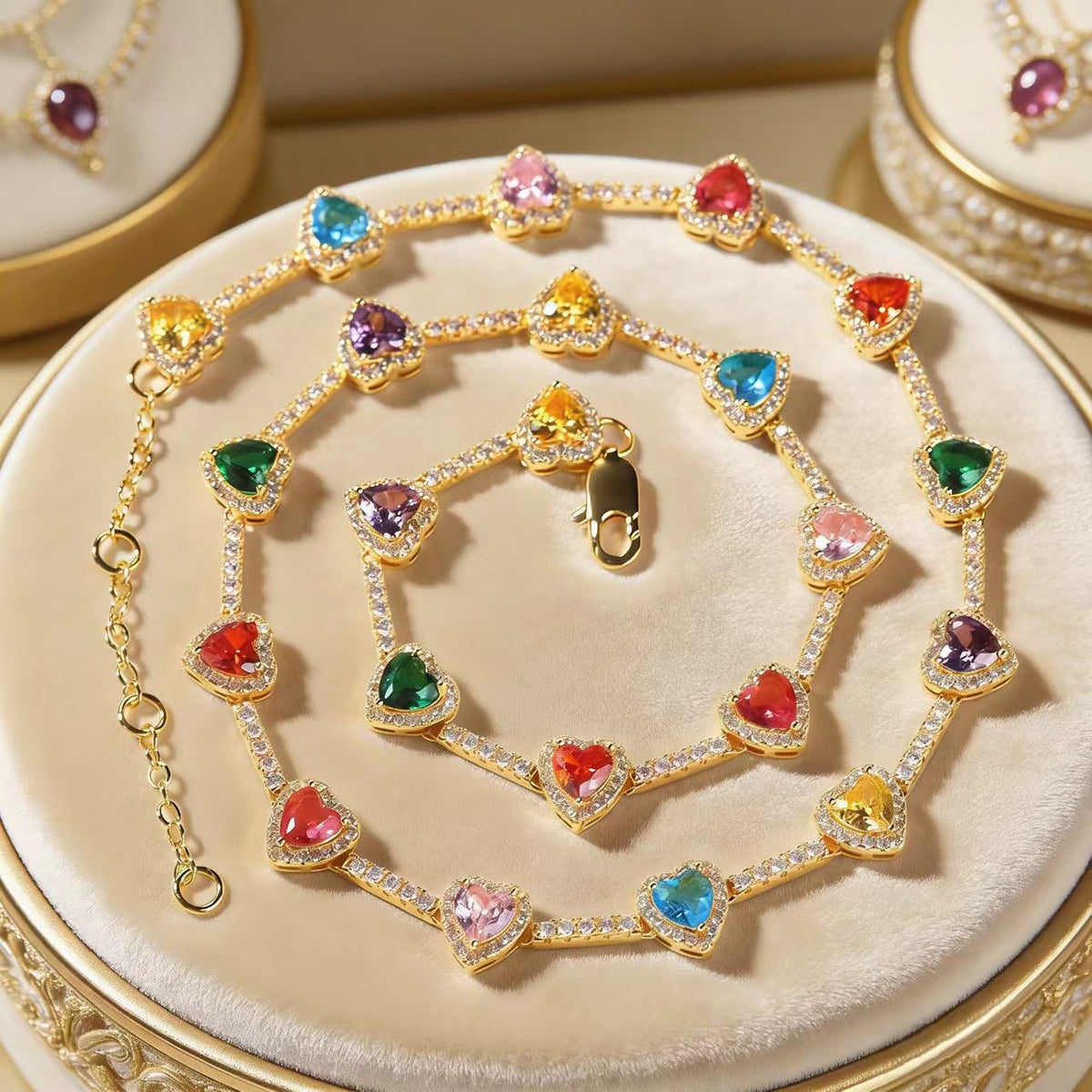 Gold Rainbow Heart Necklace on a jewelry stand