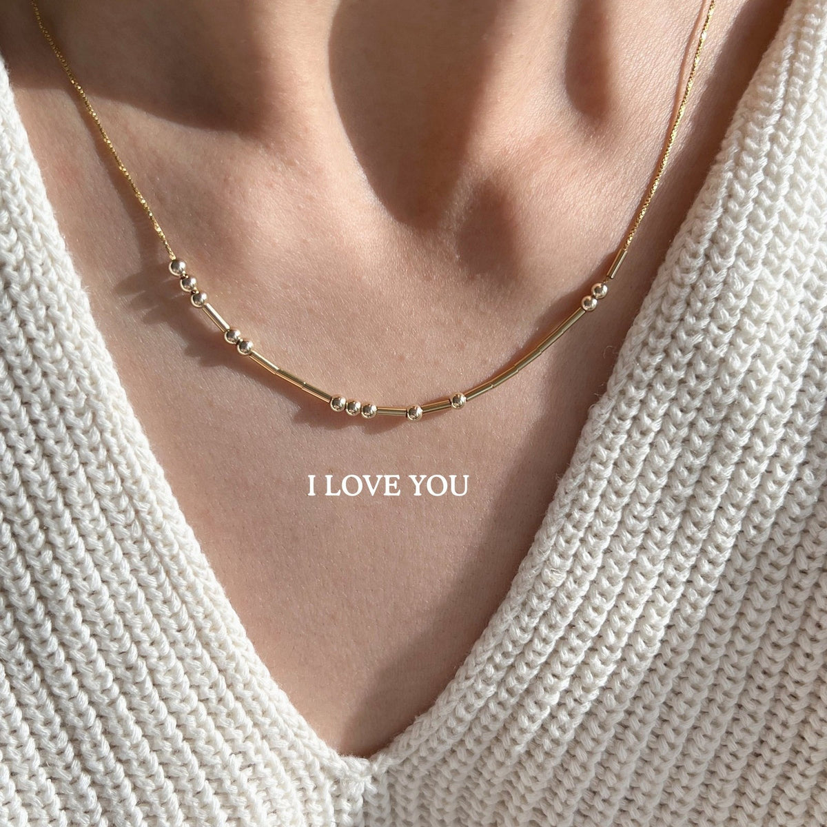 Morse code necklace spelling I LOVE YOU